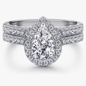 Never worn, pear shaped wedding set. Moissanite set in 14k white gold. Size 6